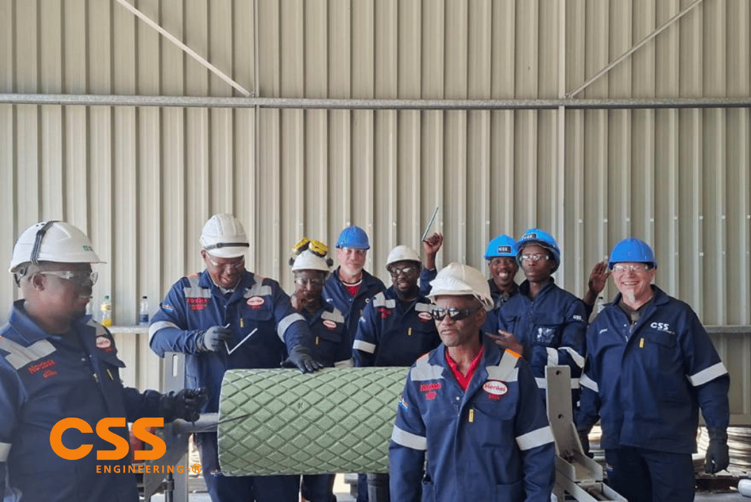 CSS Engineering and Nordbak team with completed wear-lined roller on site